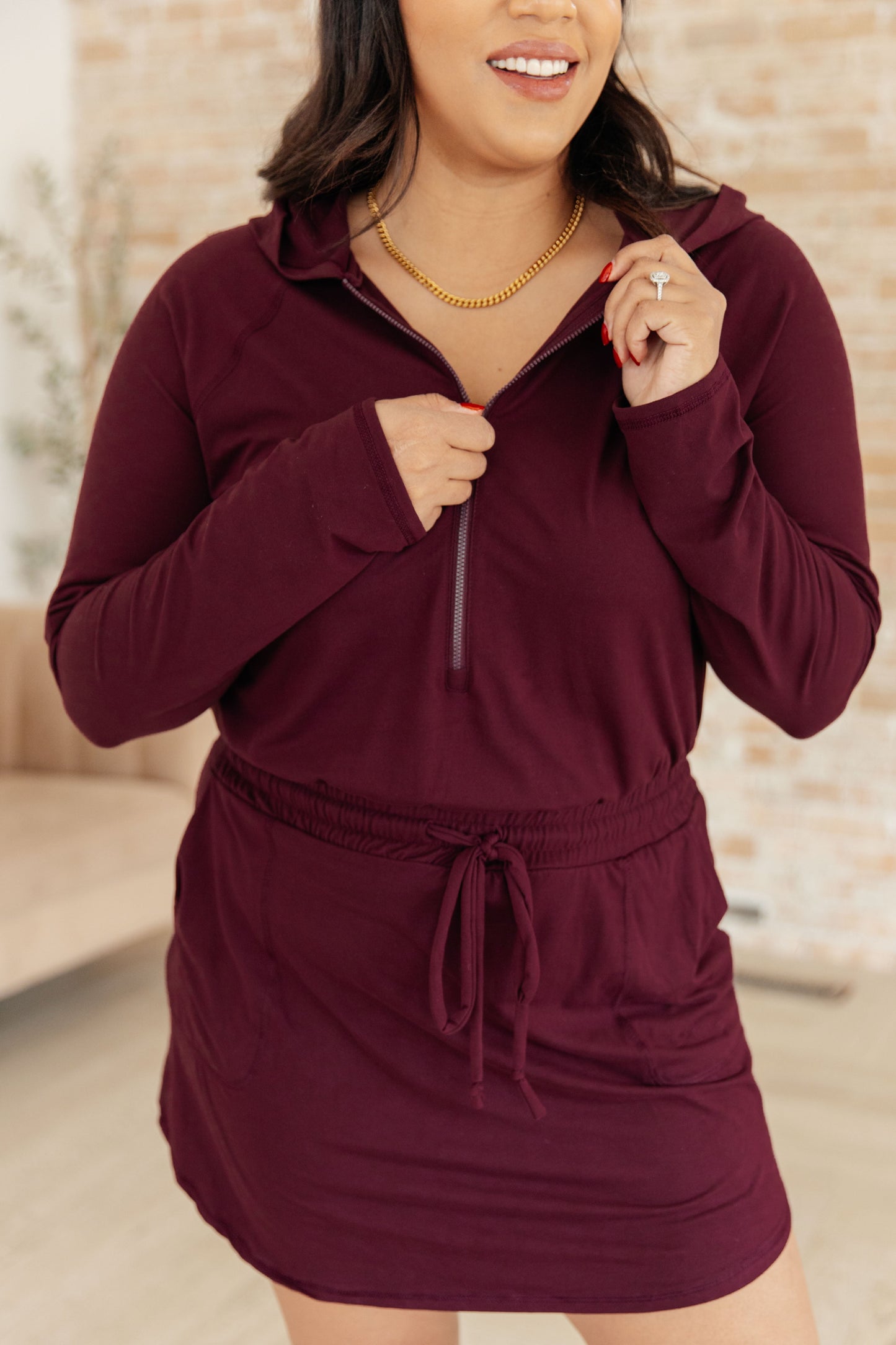 Getting Out Long Sleeve Hoodie Romper in Maroon - Dahlia Boutique